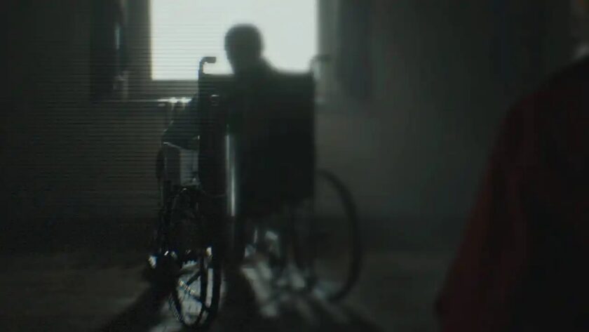 Oswell Spencer in Resident Evil Requiem — a silhouetted elderly man in a wheelchair backlit by a bright window, the Umbrella founder whose redemption arc continues in the game’s upcoming story DLC, as teased by writer Haris Orkin