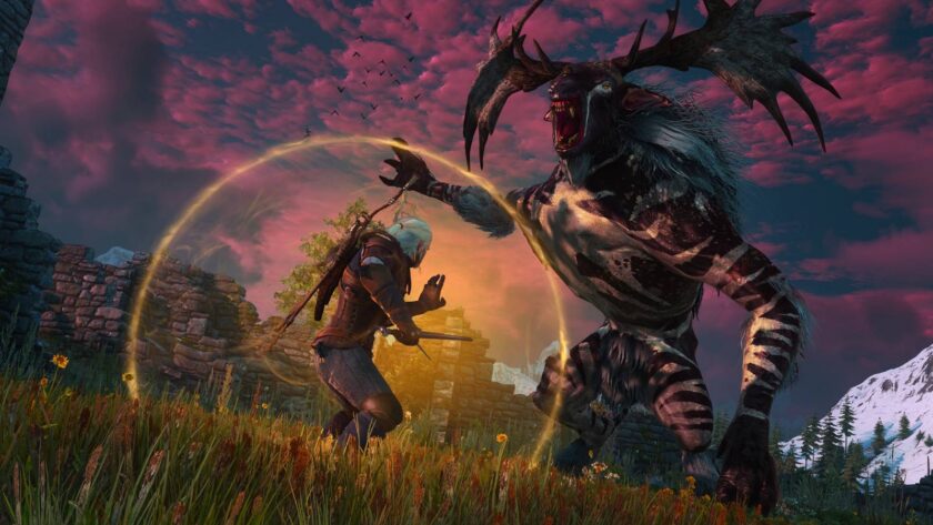 The Witcher 3 Remastered art — Geralt of Rivia in combat against a horned monster at sunset with golden magic effects, from the free update that has driven the 11-year-old RPG to its all-time Steam concurrent player record